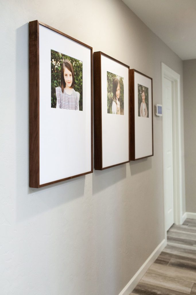 Custom framed gallery wall family portraits by Fletcher and Co