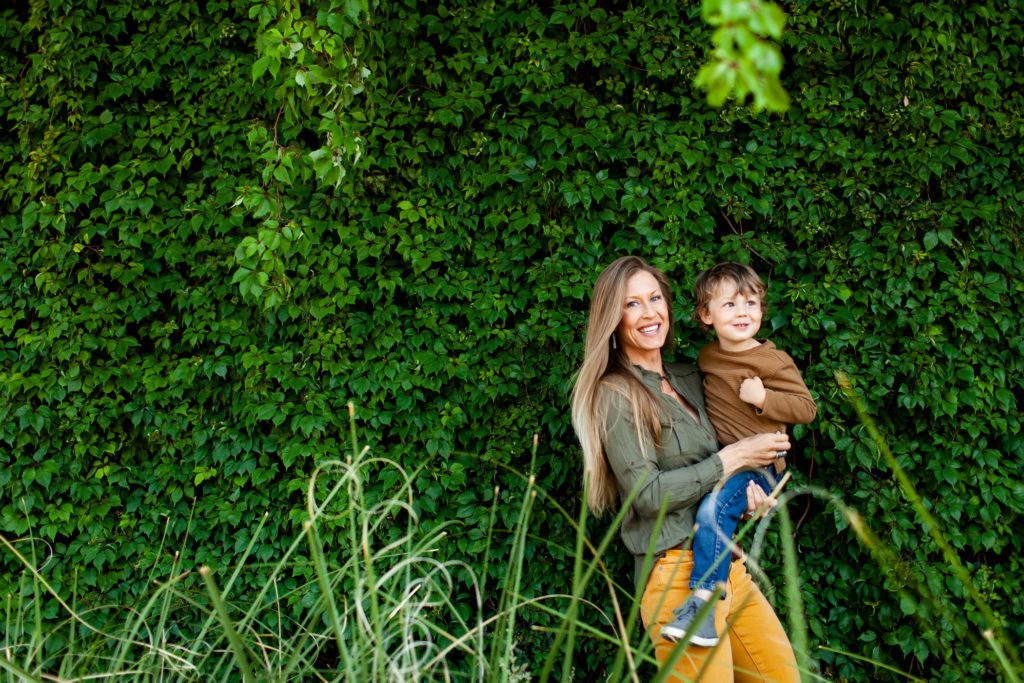 Modern outdoor spring portraits with mom and toddler son. Photography location at University of Arizona by Fletcher and Co