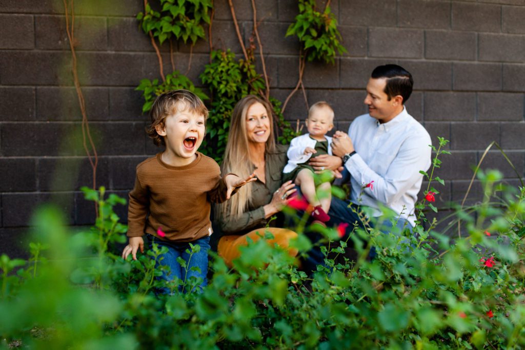 Modern outdoor spring portraits with a family of four. Photography location at University of Arizona by Fletcher and Co