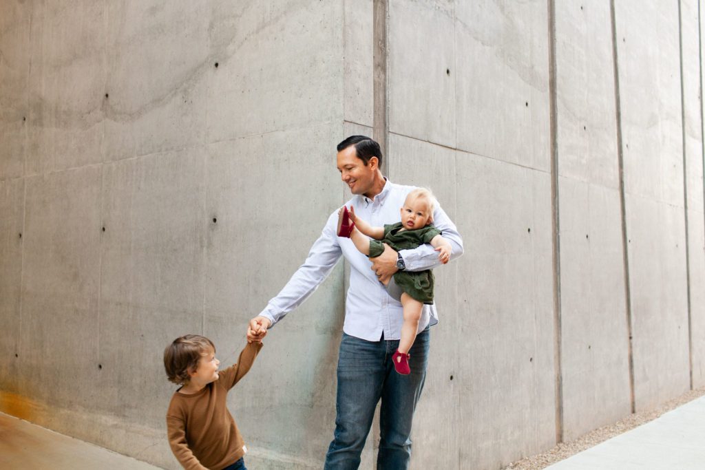Modern outdoor spring portraits with dad and children. Photography location at University of Arizona by Fletcher and Co