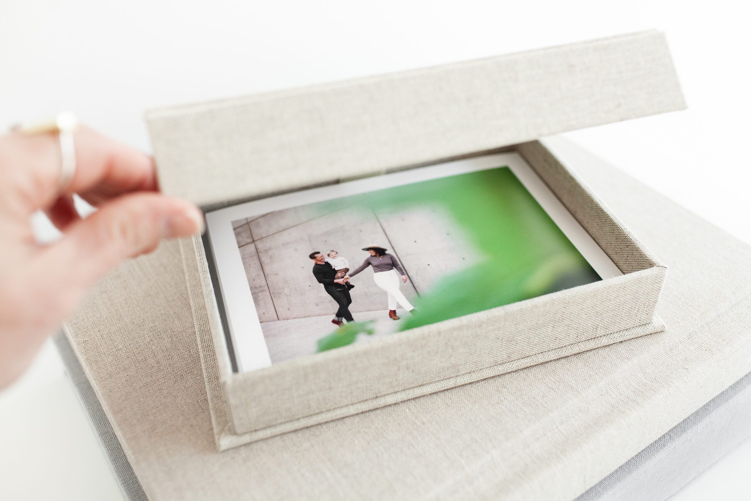 Linen keepsake photo box with bordered proof prints inside of a family portrait session by Fletcher and Co in Tucson, Arizona