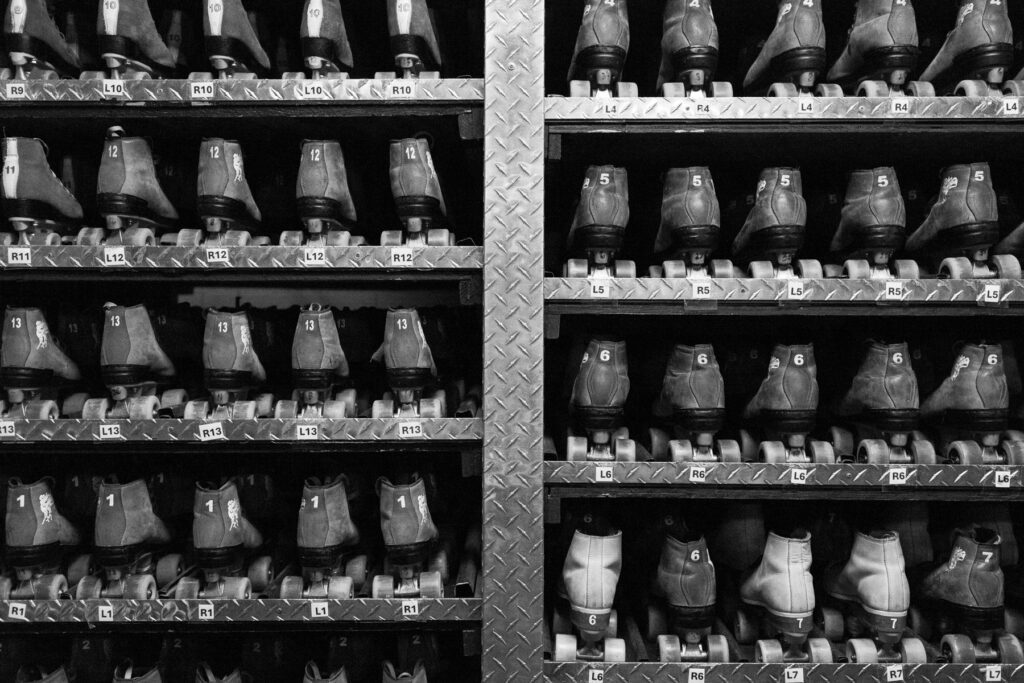 Roller skates lined up on rack at Skate Country in Tucson, Arizona