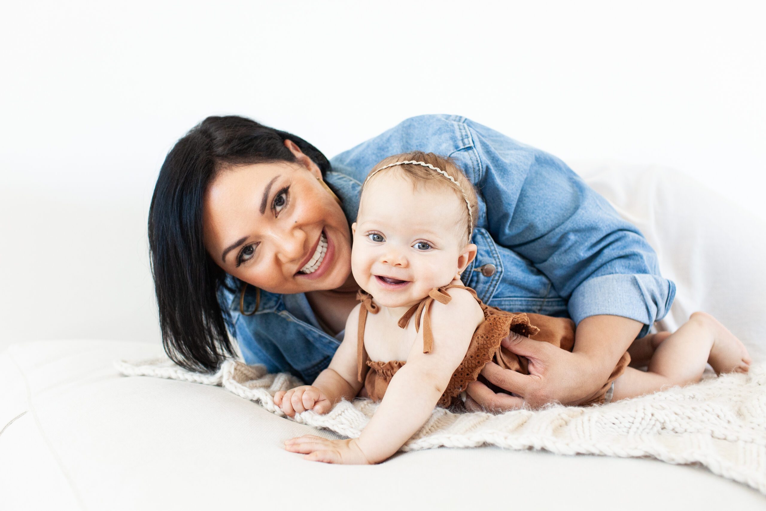 Natural light studio baby girl and motherhood portrait for local news feature with KGUN 9