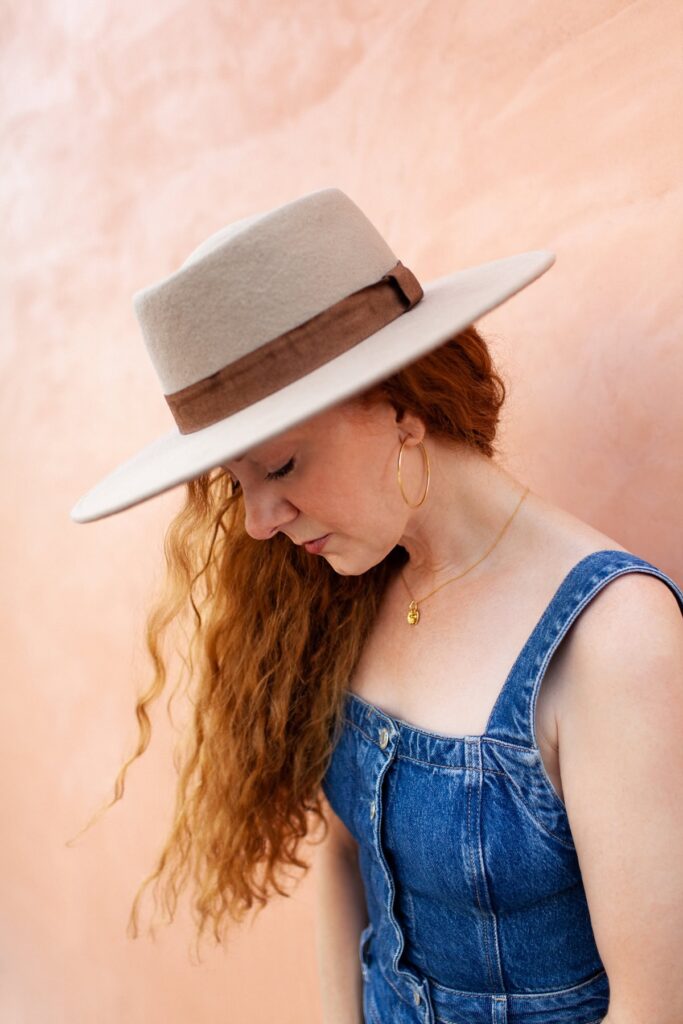 Lifestyle desert headshot of female entrepreneur photographed at Mercado District neighborhood
