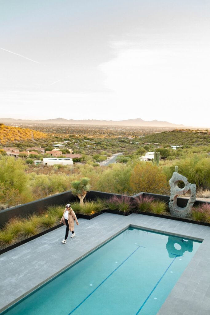 Olympic-length pool with new tile work at a mid-century private home in Tucson’s Catalina Foothills, photographed by Fletcher and Co for Box Hill Landscape Design.