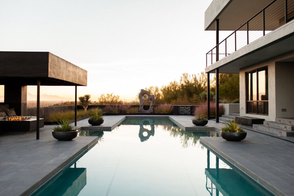 Olympic-length pool with new tile work at a mid-century private home in Tucson’s Catalina Foothills, photographed by Fletcher and Co for Box Hill Landscape Design.