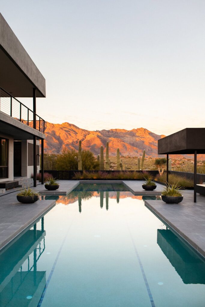 Olympic-length pool with new tile work at a mid-century private home in Tucson’s Catalina Foothills, photographed by Fletcher and Co for Box Hill Landscape Design.