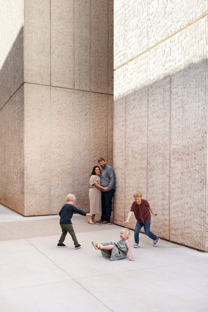 Architectural family portraits with young children running around during their photography session