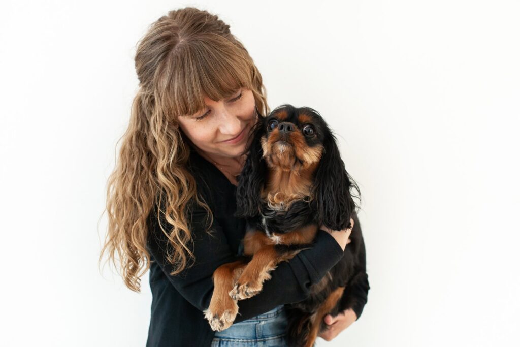 Mother hugging her dog during a modern portrait photography session in Tucson, Arizona.