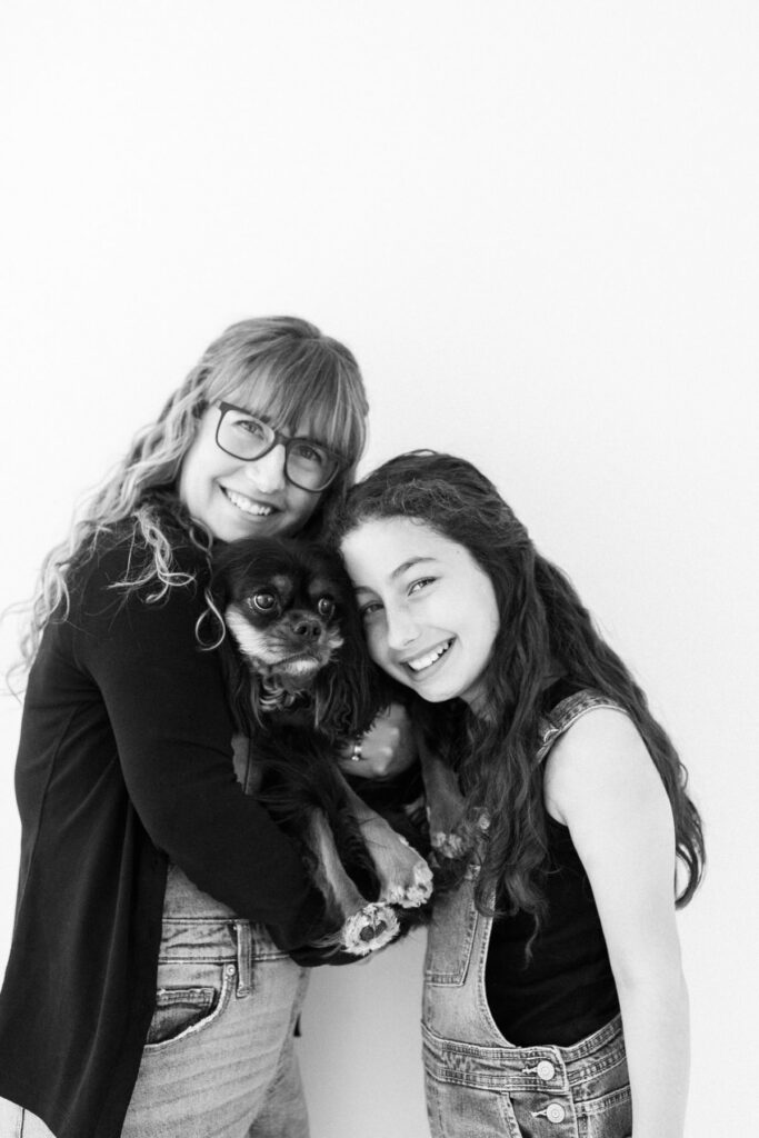 Self-captured motherhood portrait with daughter and dog during a modern motherhood photography session in Tucson, Arizona.