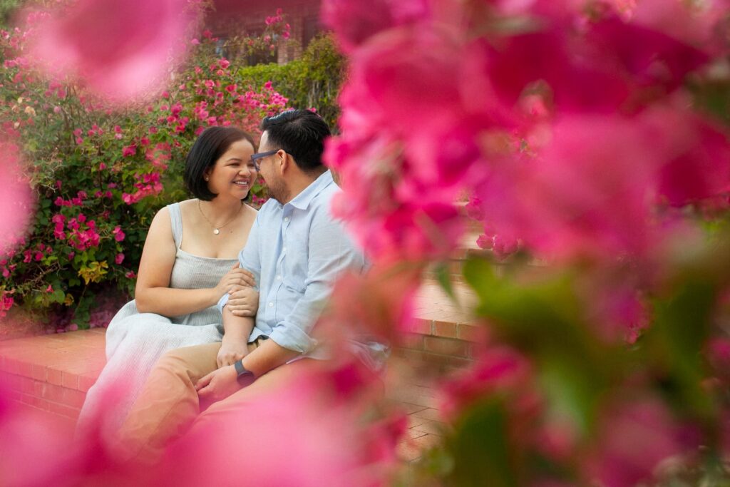 Tucson family photography session captured outdoors during spring with natural light and emotional connection between the parents sitting on the brick stairs