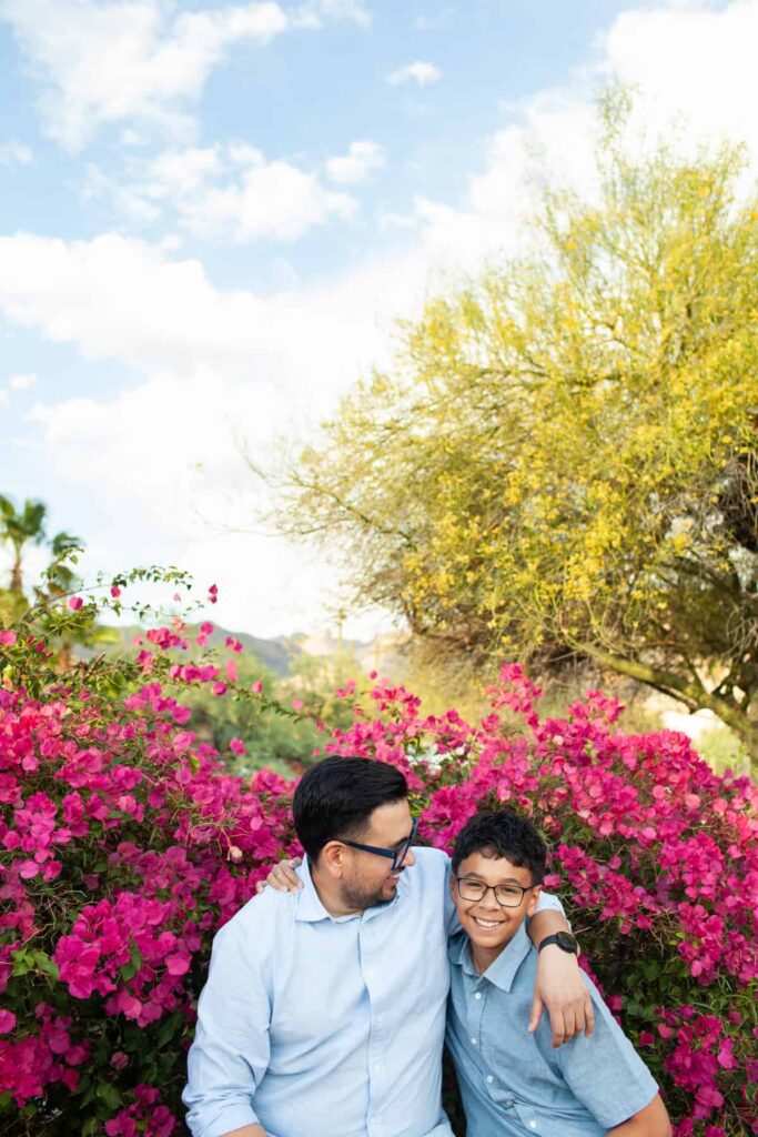 Tucson family photography session captured on their desert property, father and son hugging